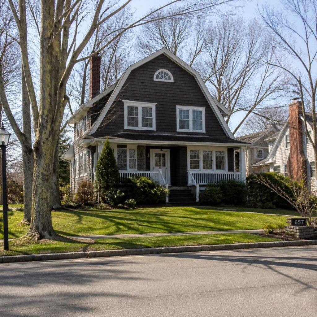 A realistic exterior image of 657 Boulevard in Westfield, New Jersey, known as the Watcher house, shown as a quiet suburban home on a tree-lined street in daylight, with a natural photographic look. 